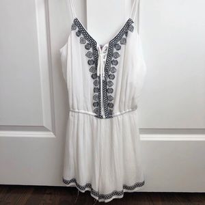 White romper with blue design size small.